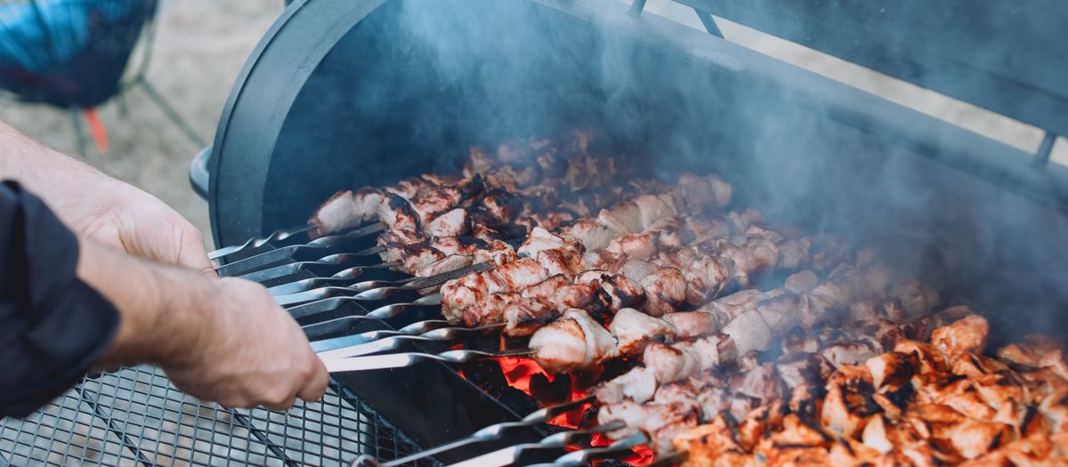 Enjoy the sizzling and smoky flavor of meat grilled outdoors, perfect for BBQ enthusiasts.